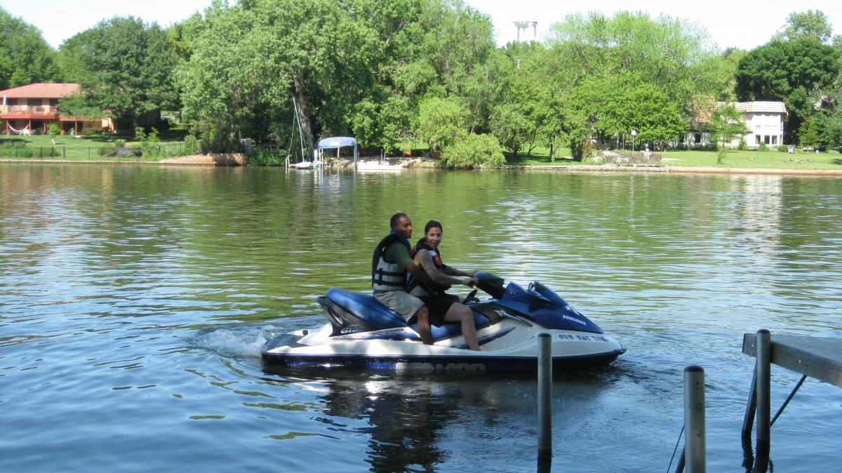 Picture of graduate student and Eve on the lake.